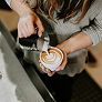 Barista pouring latte art